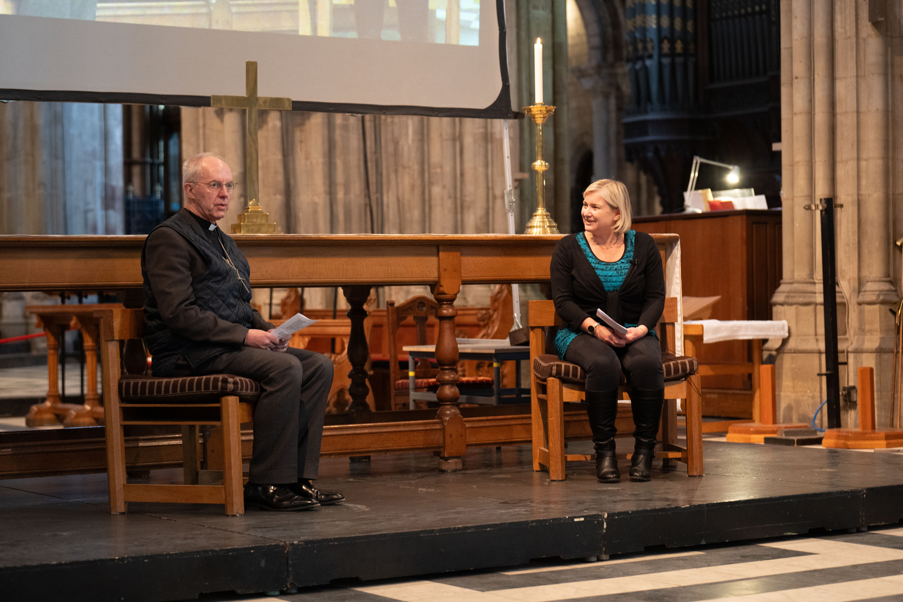 Archbishop Justin sitting at the front of the Cathedral being interviewed by Sam Setchell