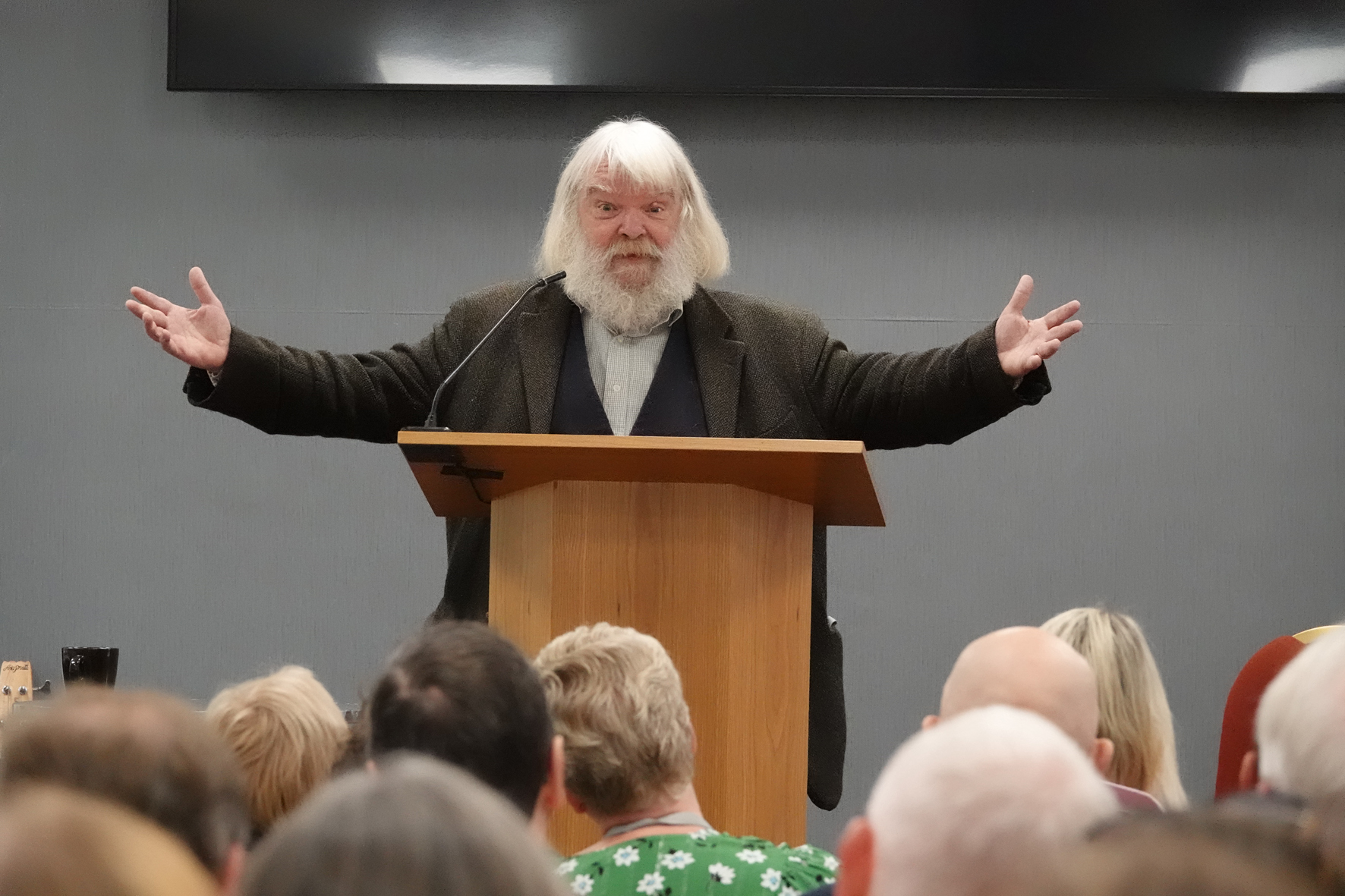 Malcolm Guide speaking with his arms outstretched at the clergy conference