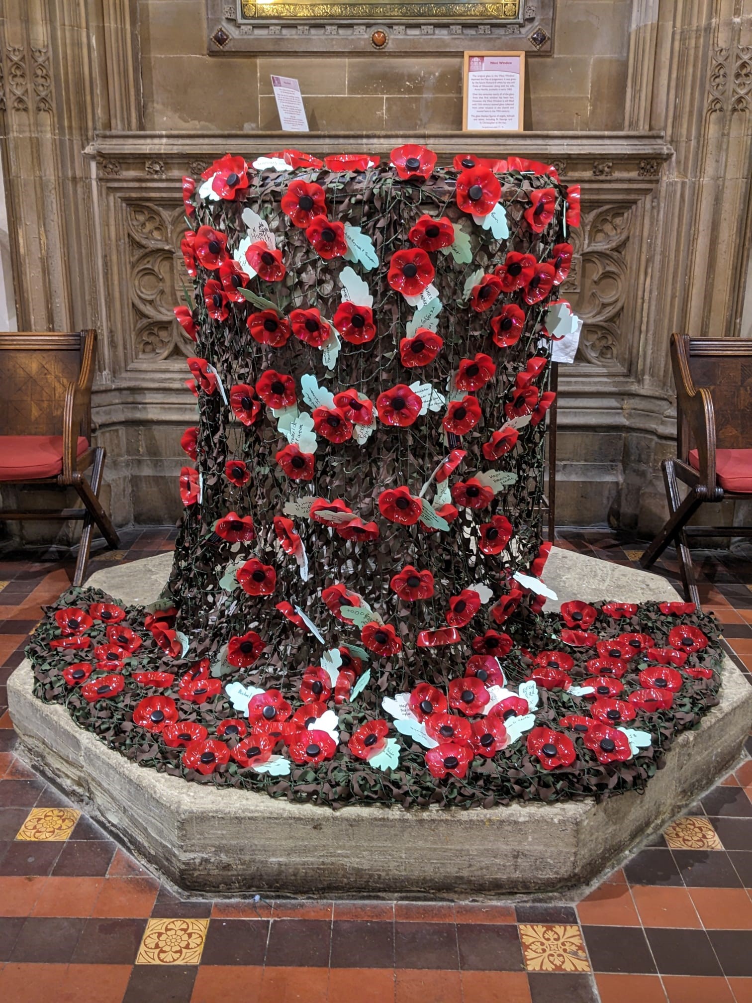 Poppies draped over the font at Great Malvern Priory