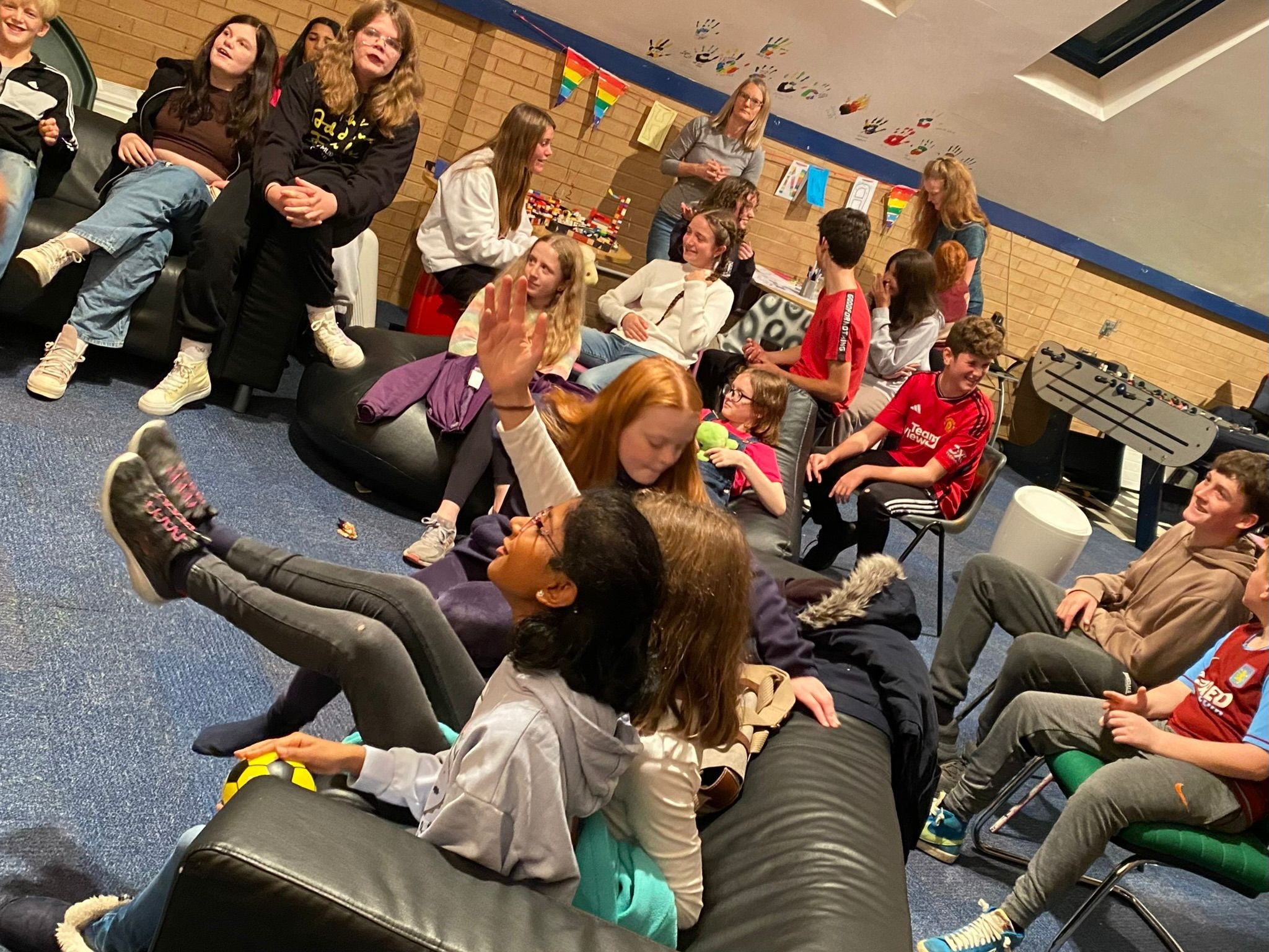 Children chilling out on chairs at the Evesham youth group