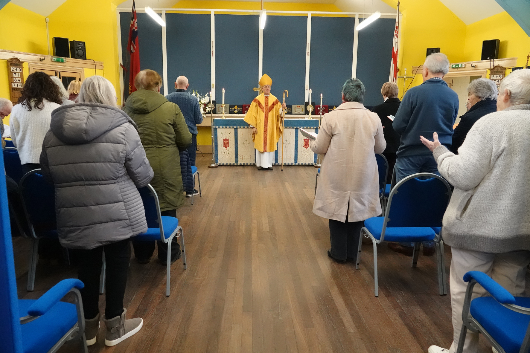 Bishop John standing at the front of St John's Church in Dudley