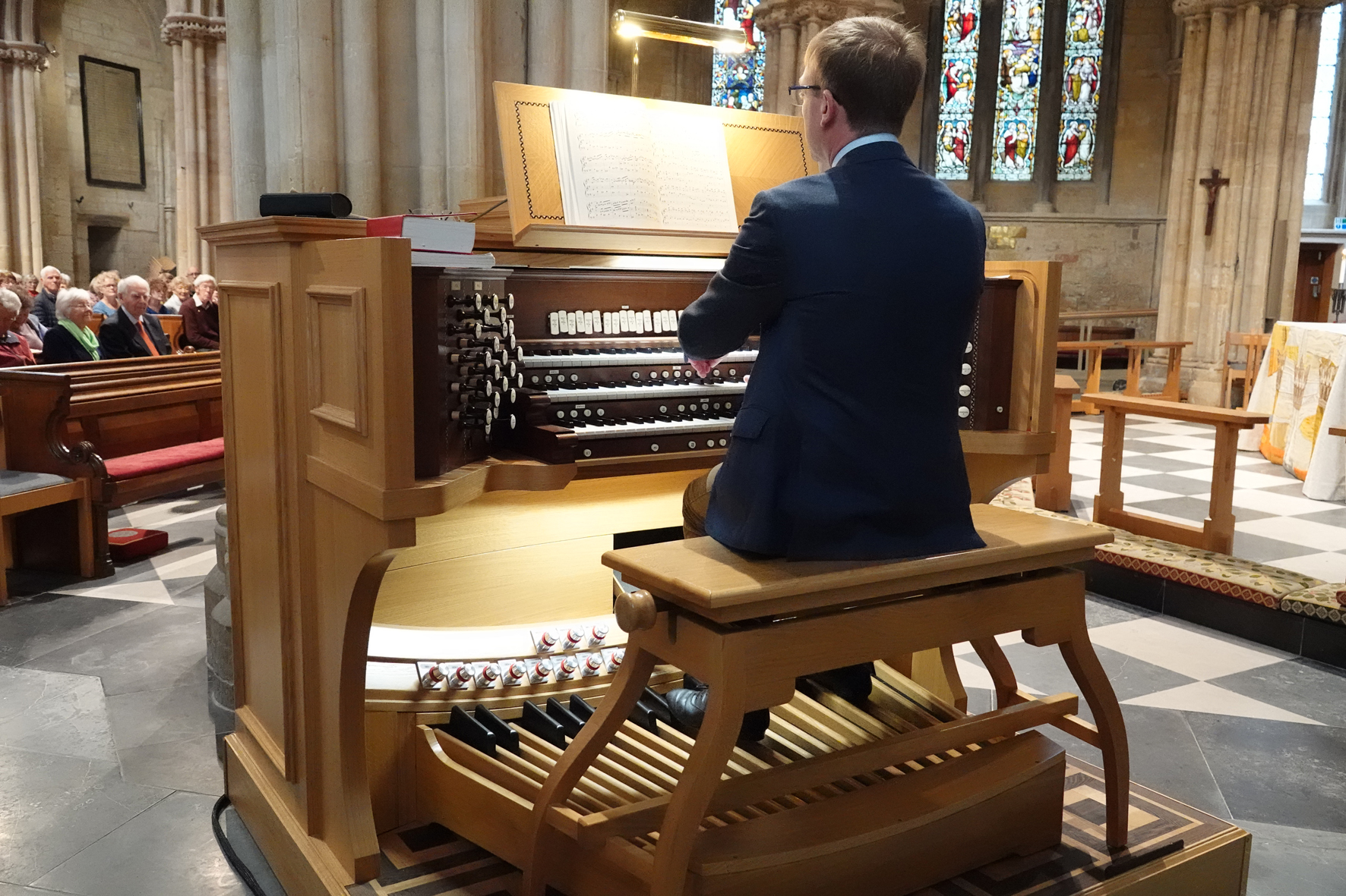 Organist Robert Quinney sat playing the new organ in Pershore Abbey