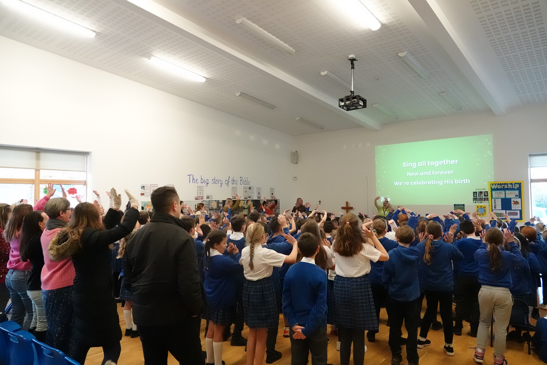 Whole school and parents dancing at the iSingPop intergenerational workshop