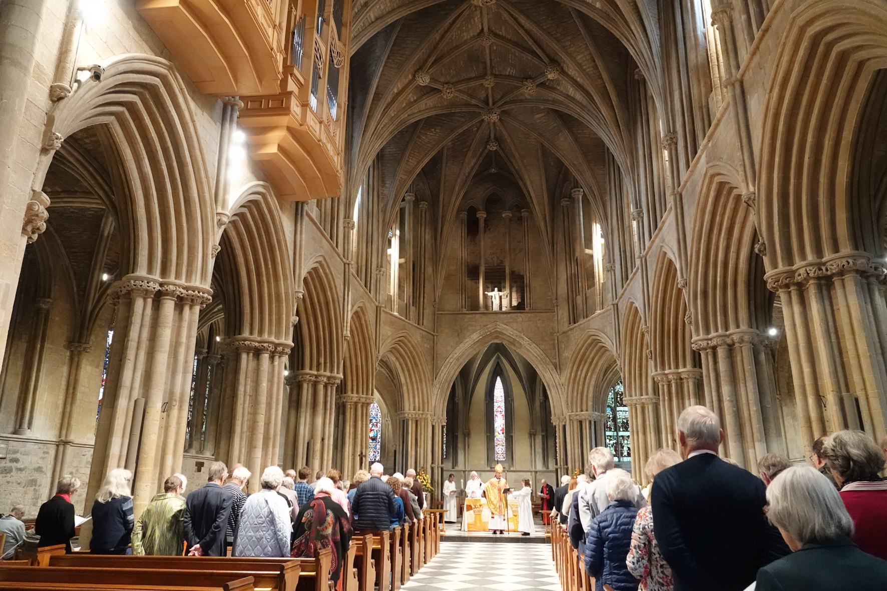 Bishop John standing at the front of Pershore Abbey blessing the new organ