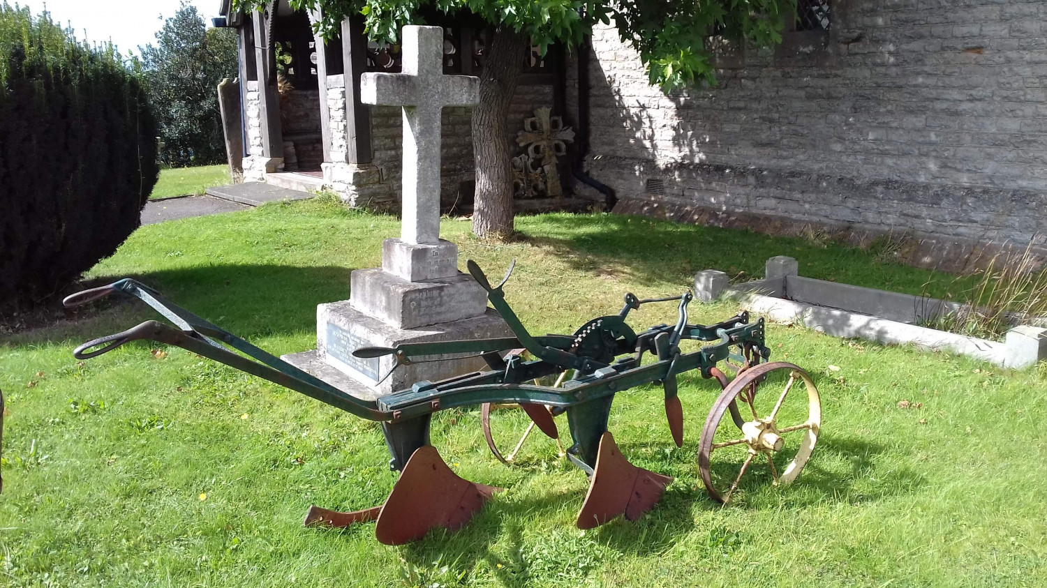 Old fashioned plough in a churchyard