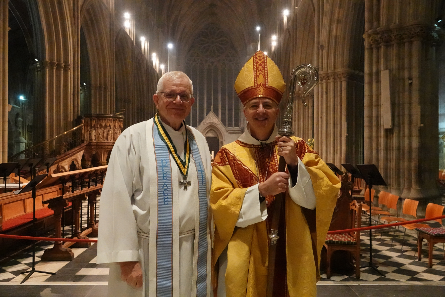 Dick Johnson wearing the Wulfstan Cross and standing next to Bishop Hugh in the Cathedral