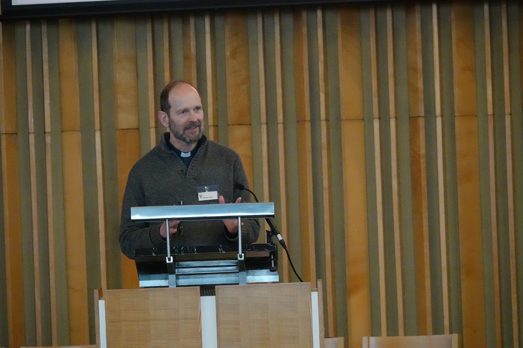 Robin Parry standing at a podium