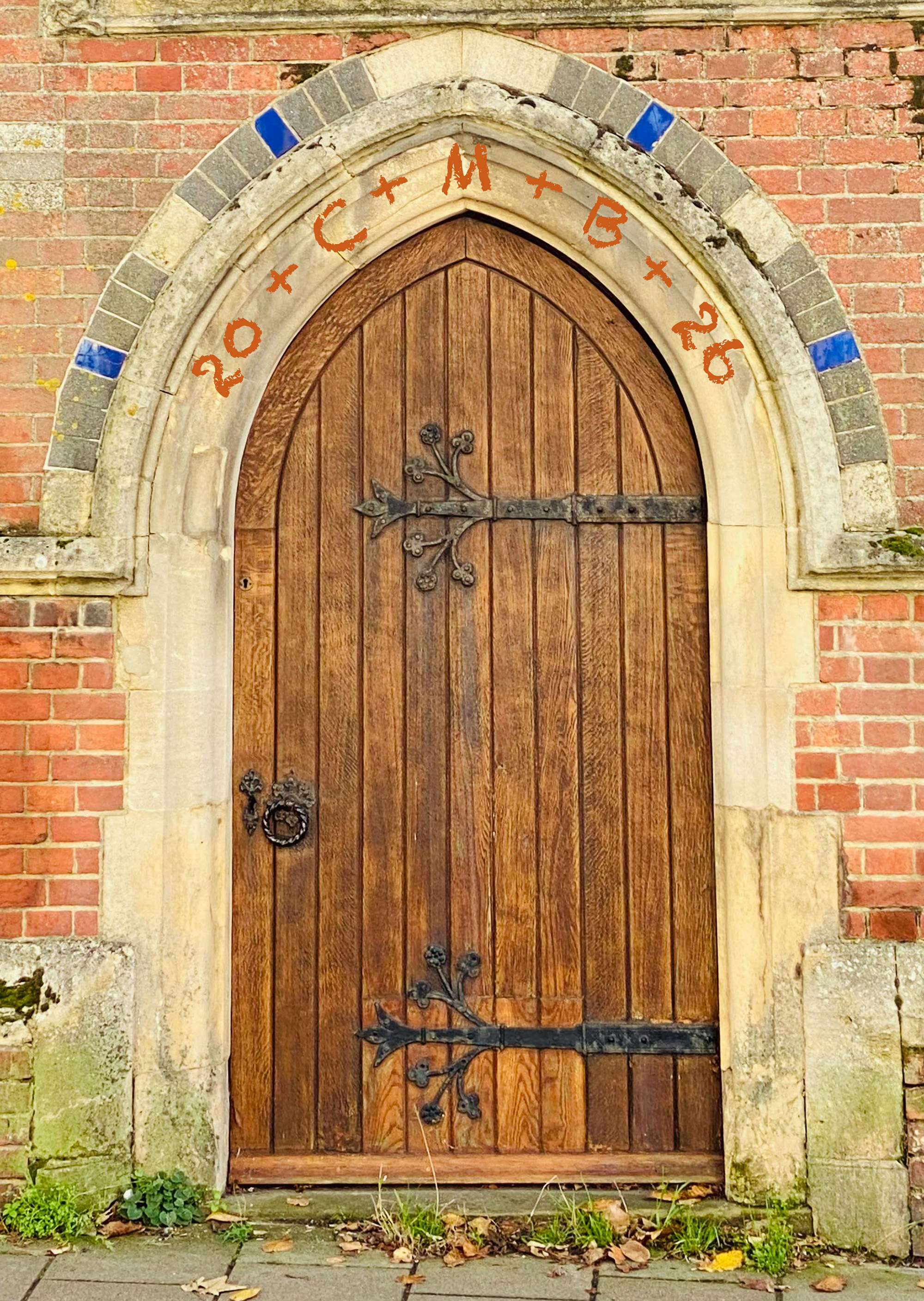 A church door with an Epiphany blessing written over the top