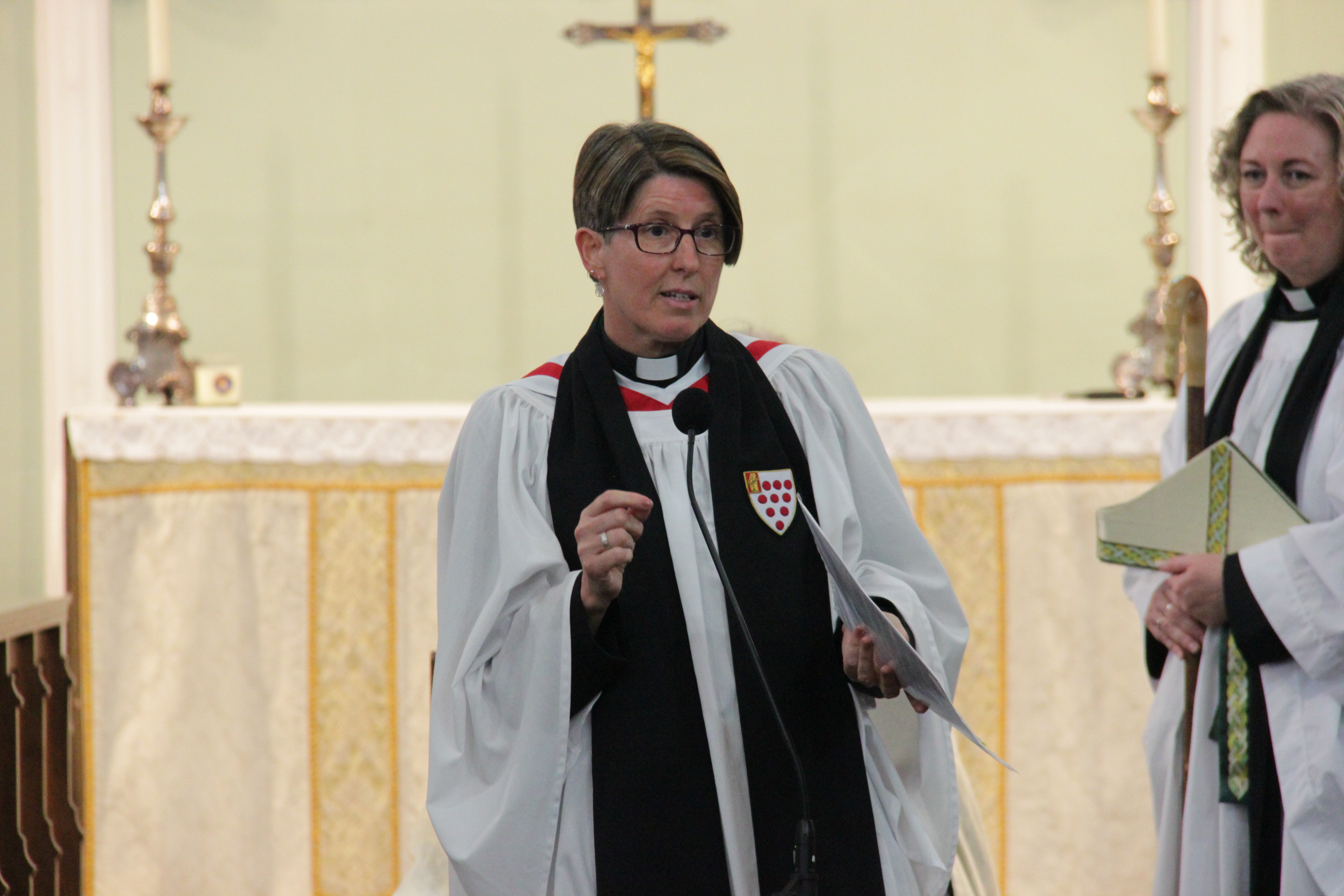 Diane Cooksey speaking at the front of All Saints Church in Sedgley