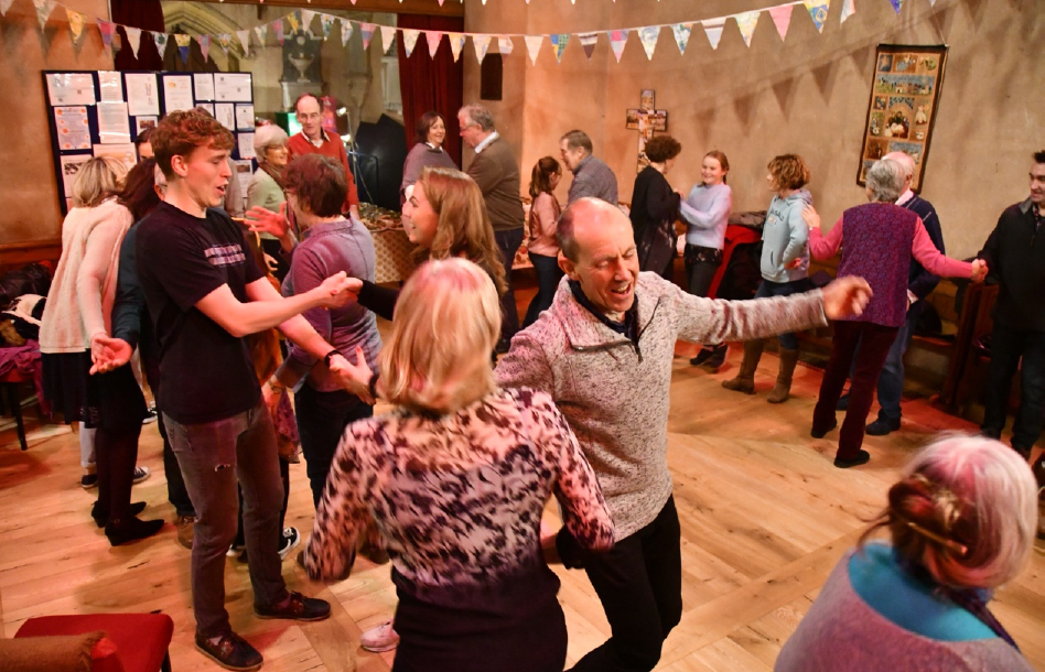 People dancing at the Ceilidh in Suckley Church