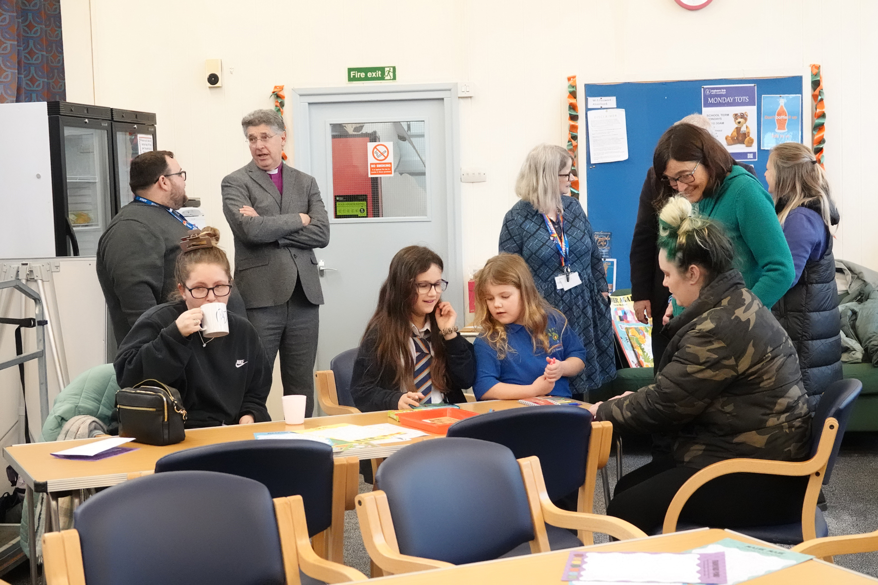 People chatting at the Malvern after school club including Bishop Martin
