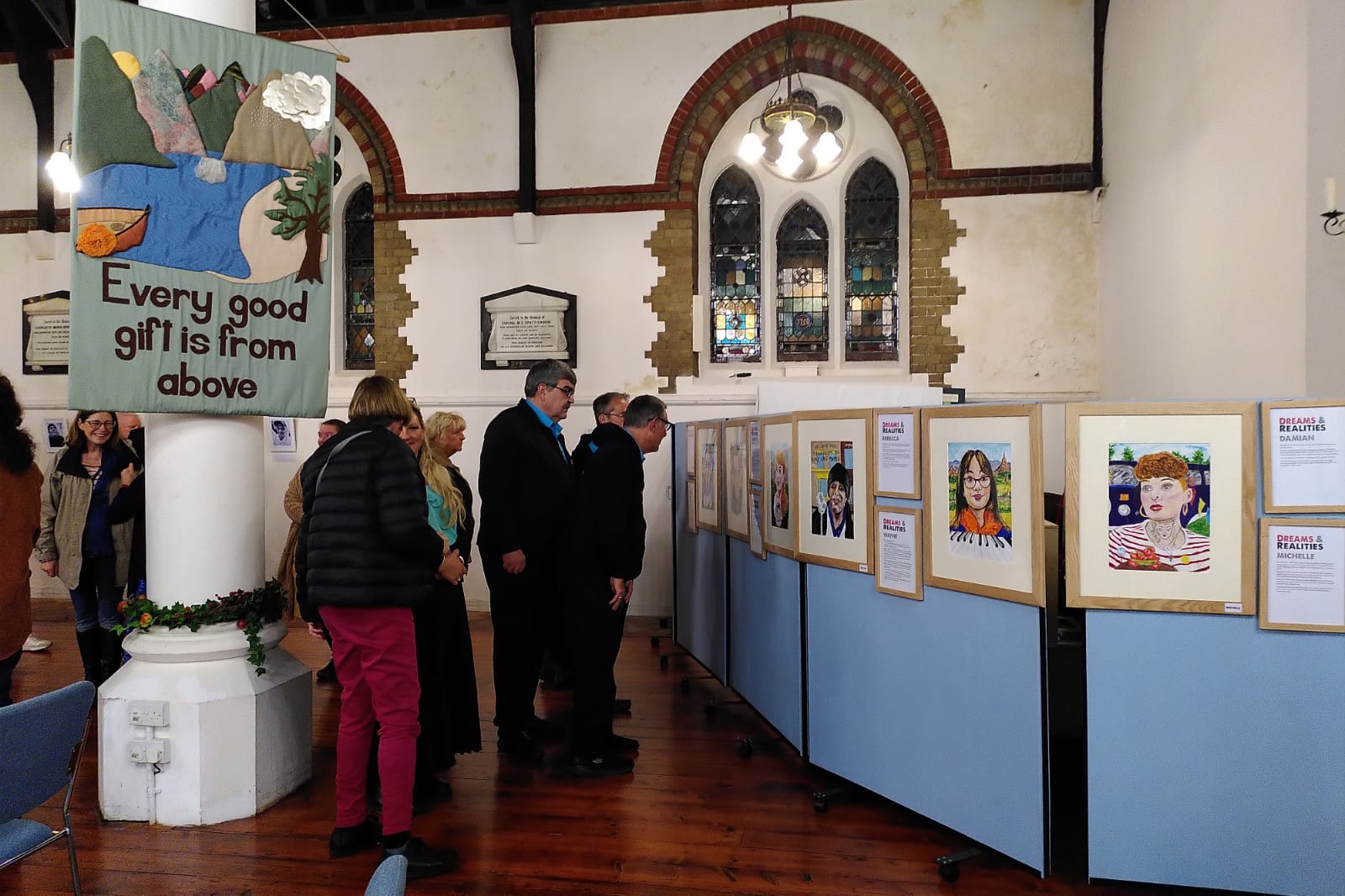 People looking at an art exhibition.
