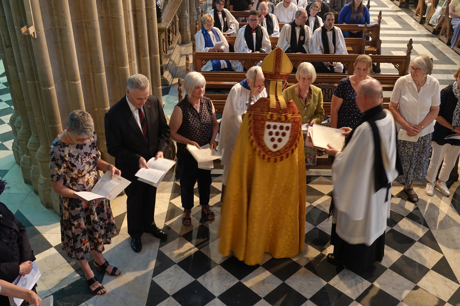 Bishop John presenting certificates to the ALMs in the Cathedral