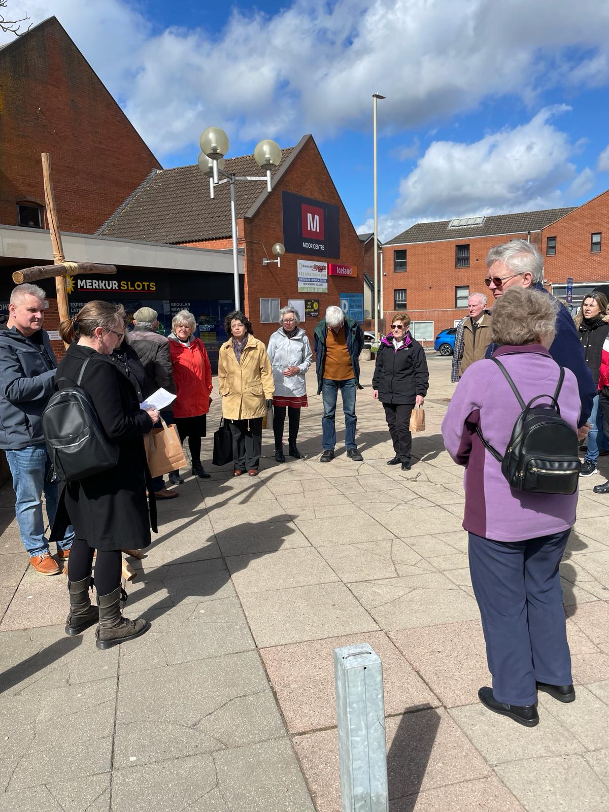 Group of people gathered around the cross in Brierley Hill