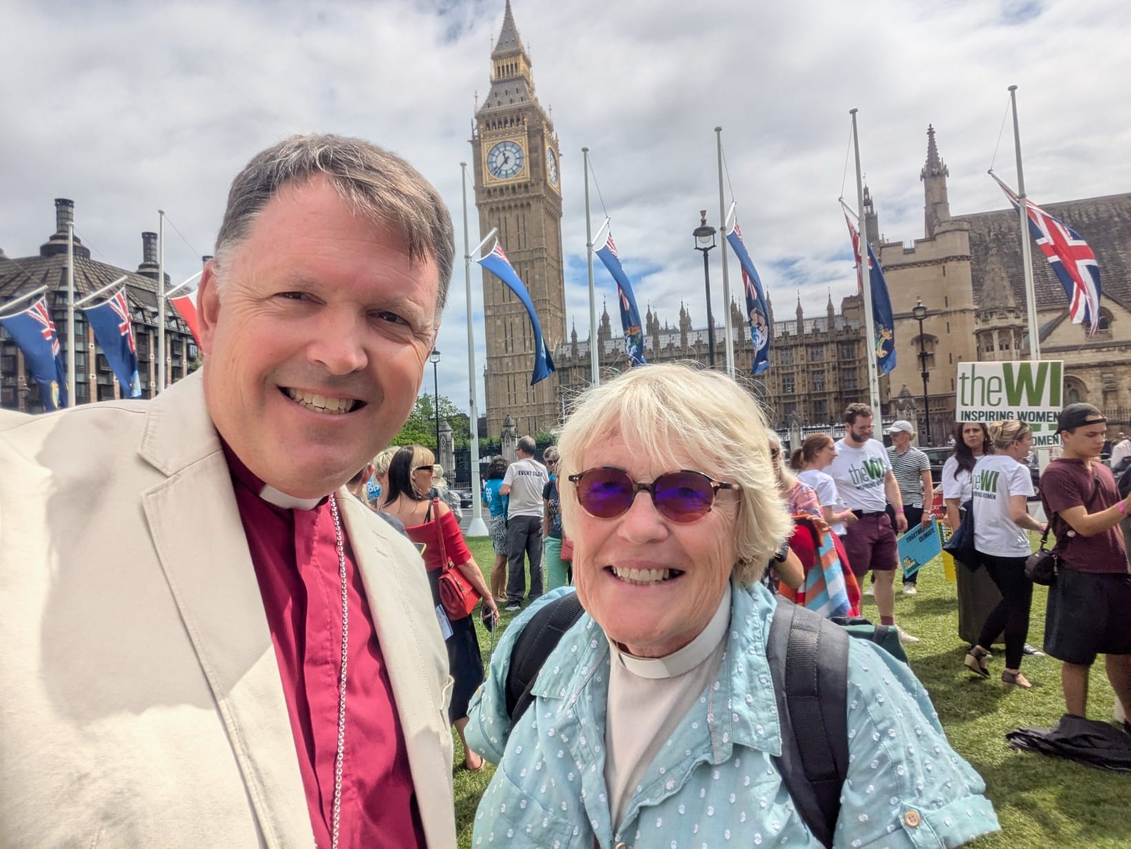 Bishop Graham standing with Sue Adeney outside the Houses of Parliament