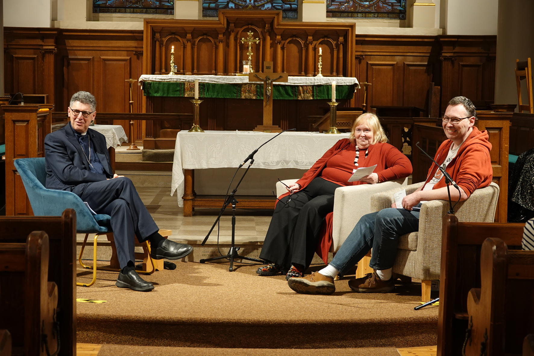 Bishop Martin being interviewed by two ALMs at the front of church