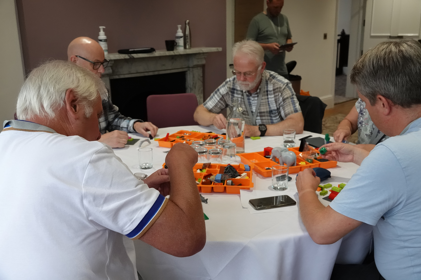 People building lego models at a workshop at clergy conference