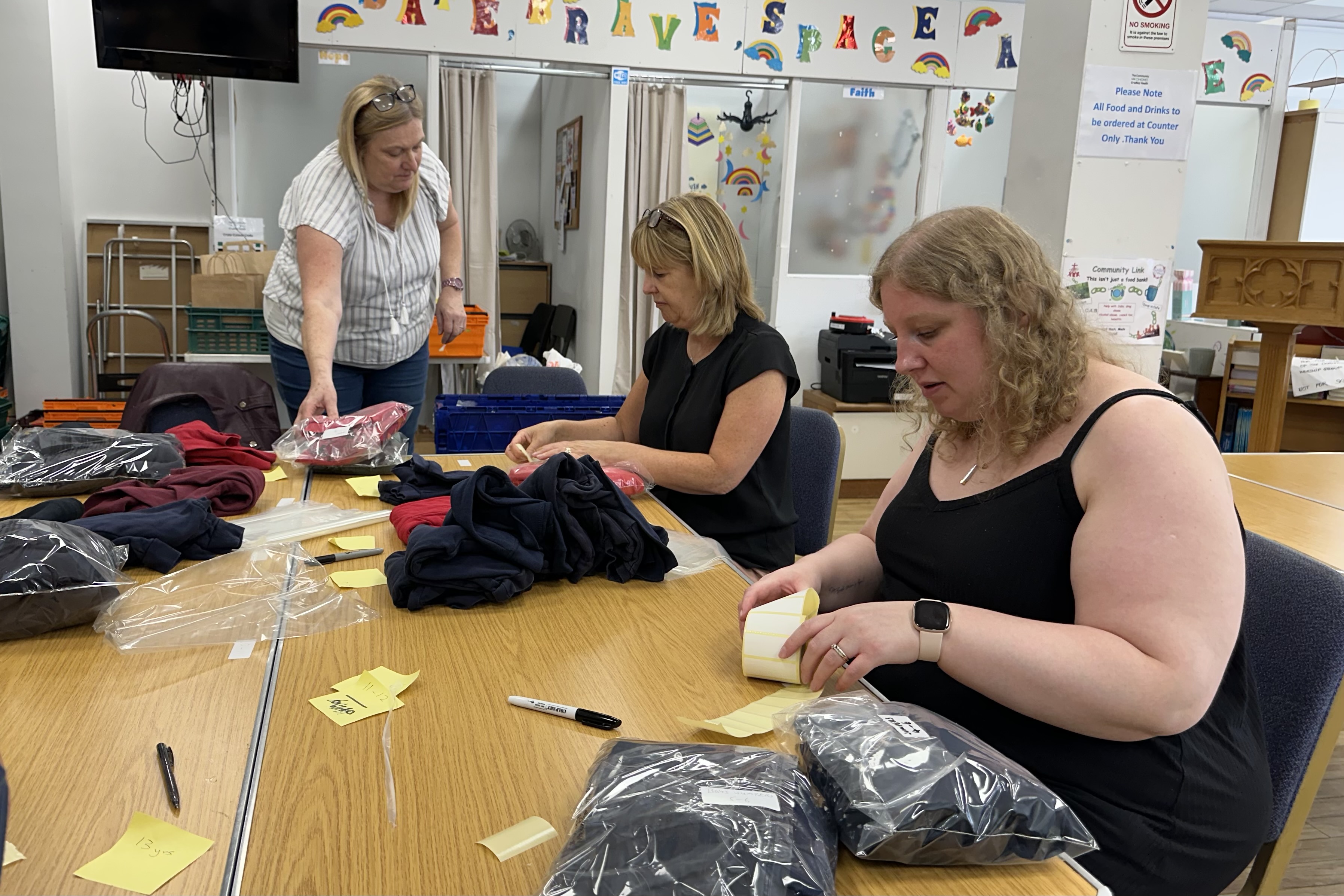 Volunteers sort uniform