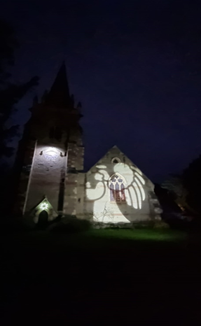 Projection of an angel on Madresfield Church