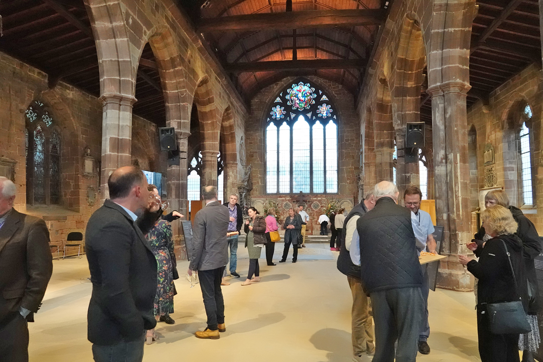 People chatting inside St Helen's Church on the reopening evening.