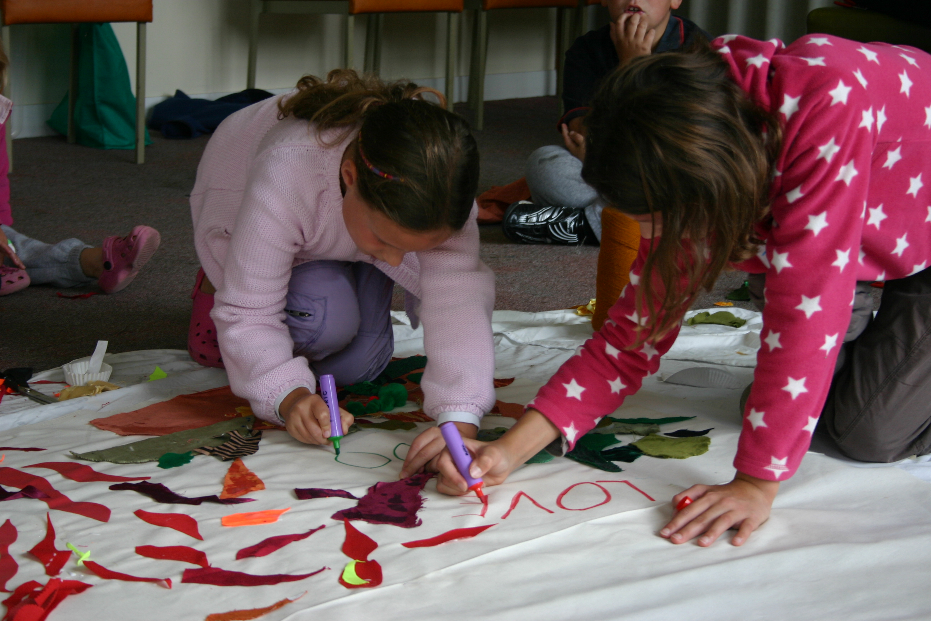 Someone working with a young person in church