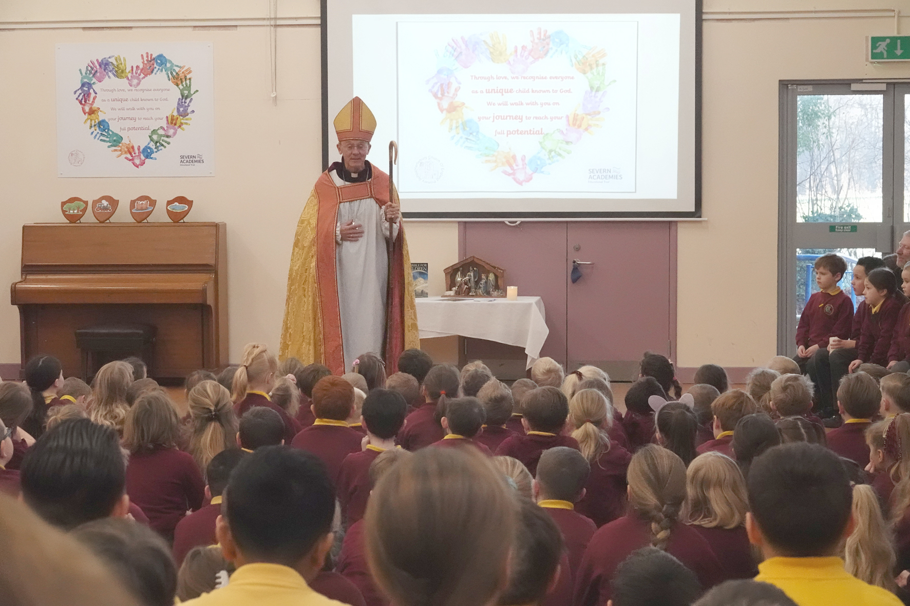 Bishop John talking to the children in Hartlebury school's assembly