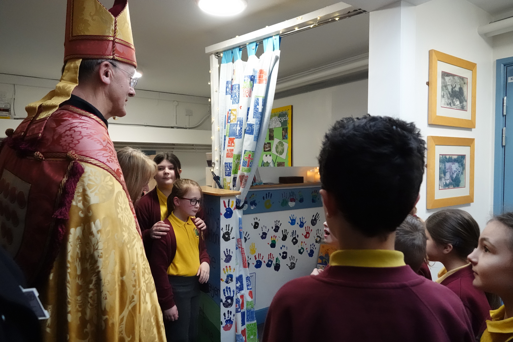 Pupils show bishop John their new prayer and reflection space