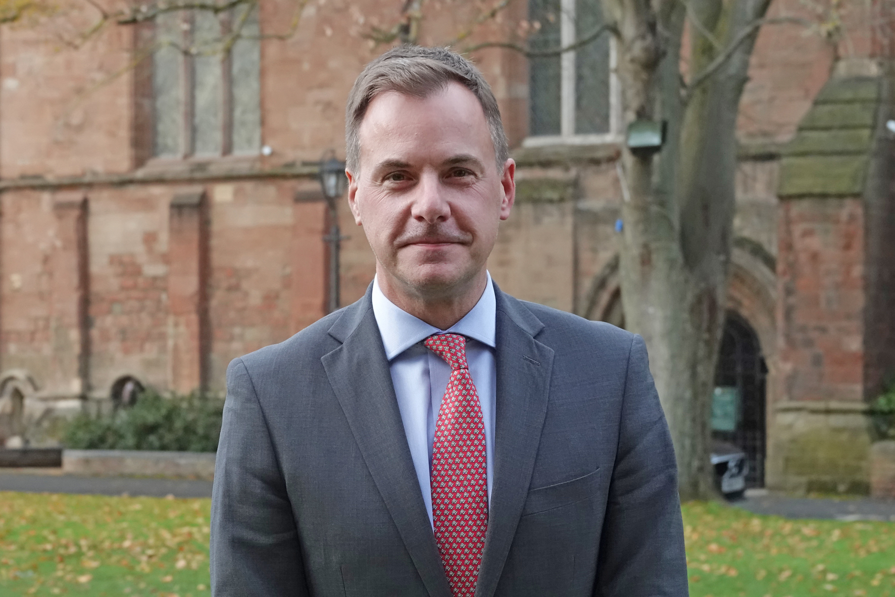 Gareth Doodes standing outside of the Cathedral