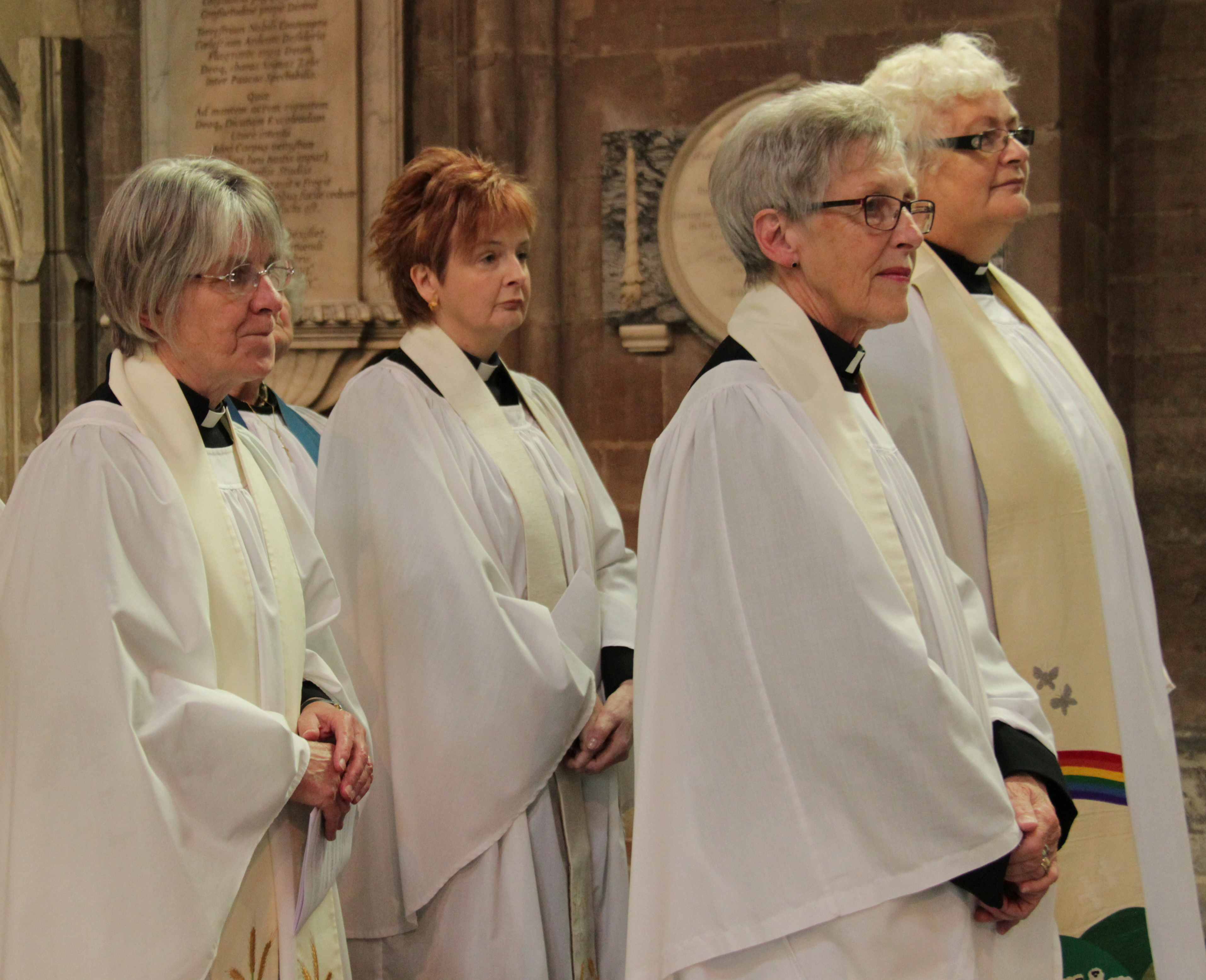 4 women priests standing in the cathedral