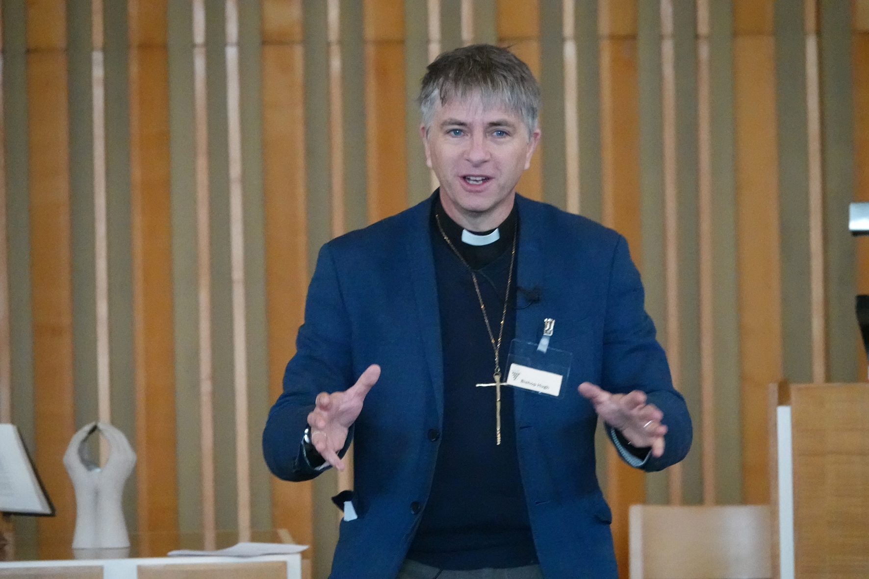 A close up of Bishop Hugh talking to clergy