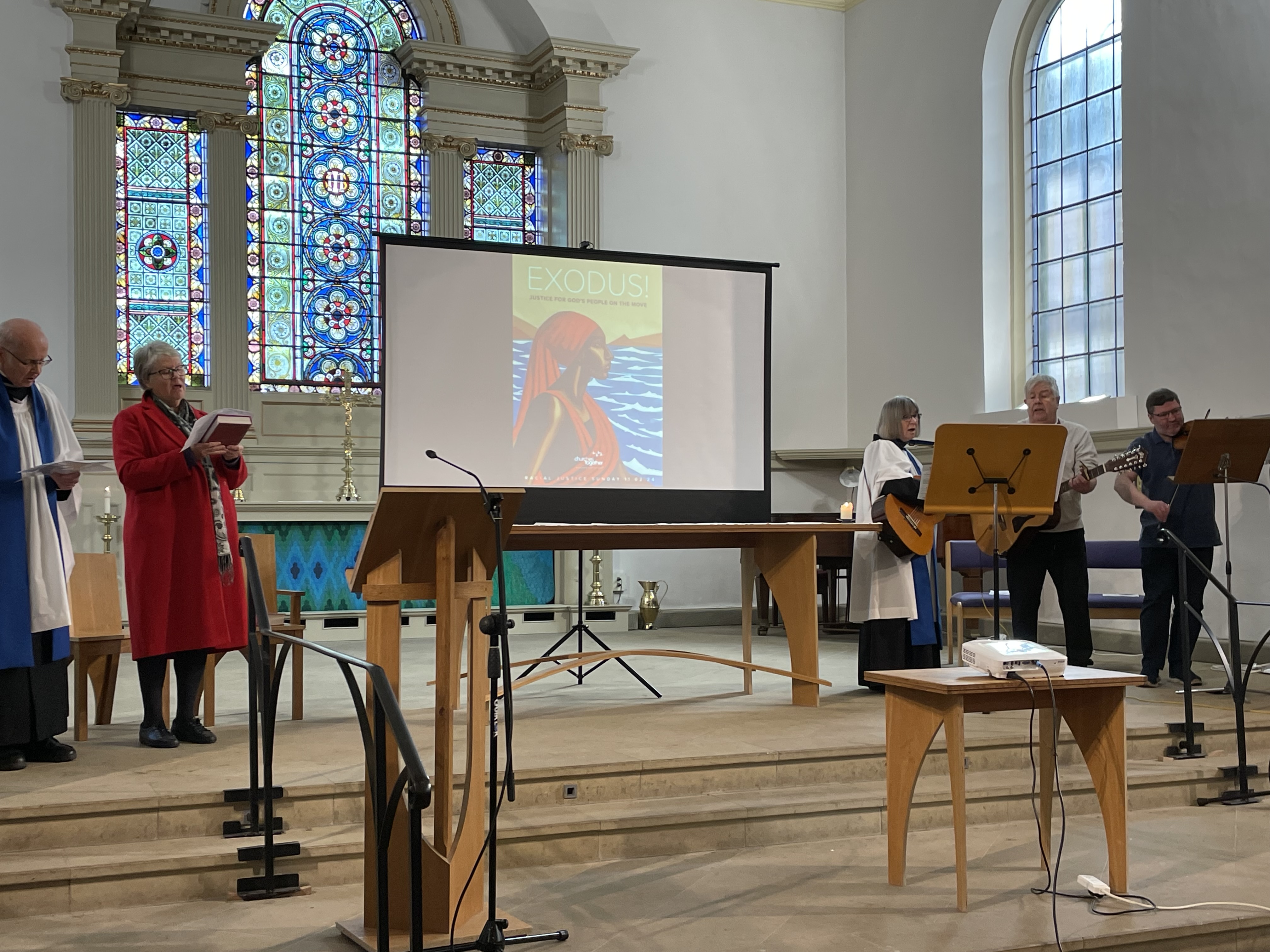 Service leaders gathered at the front of St Anne's Church for their racial justice service