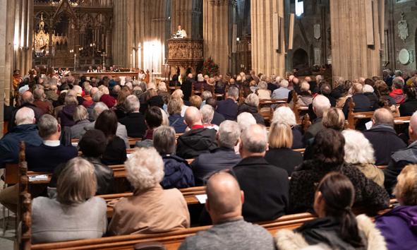 Robert Jones preaching in front of a packed cathedral nave