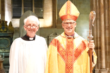 Robert Holdsworth standing next to Bishop Martin in the Cathedral