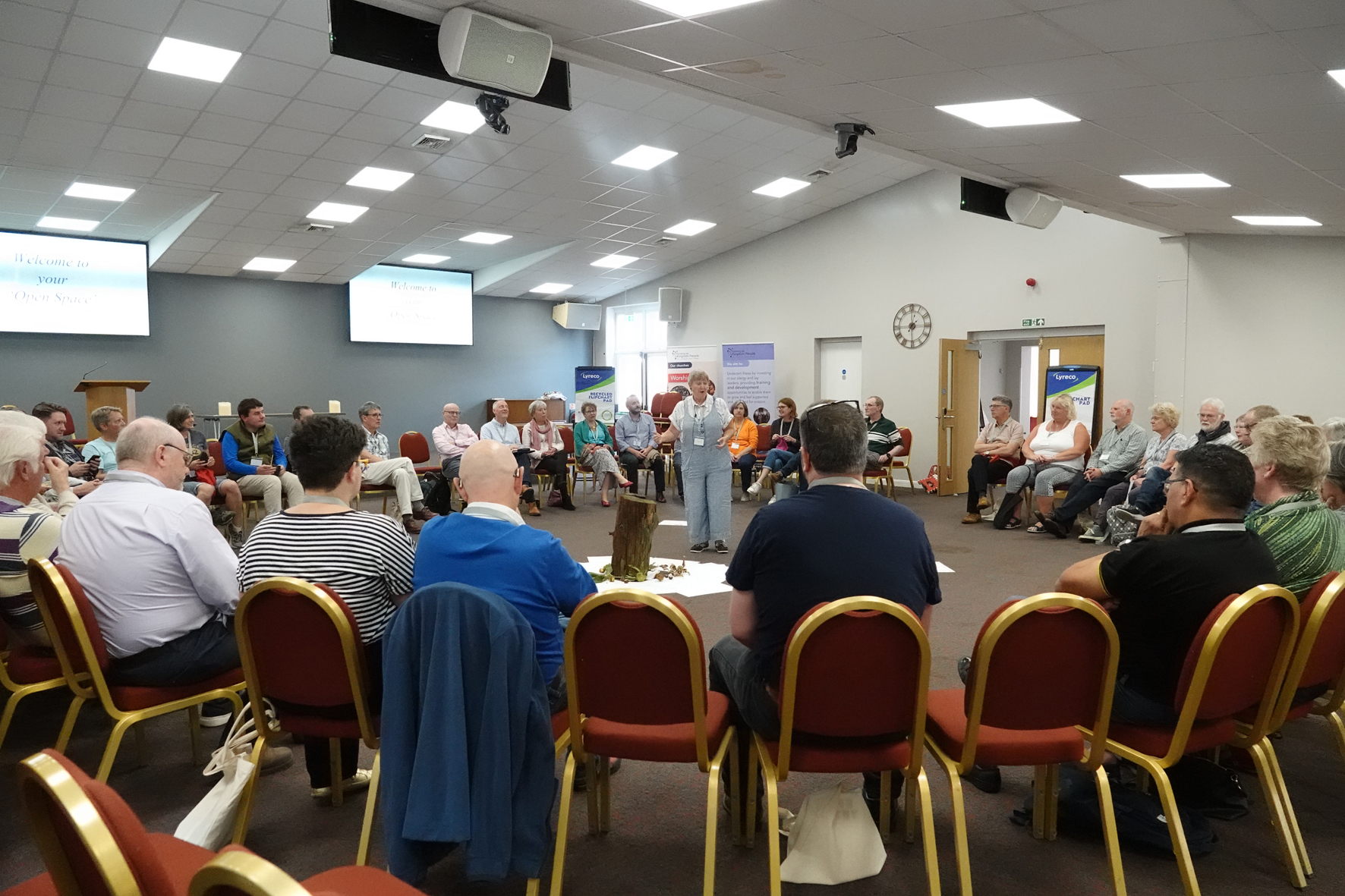 Clergy sitting in a circle with Alison Maddocks speaking in the middle