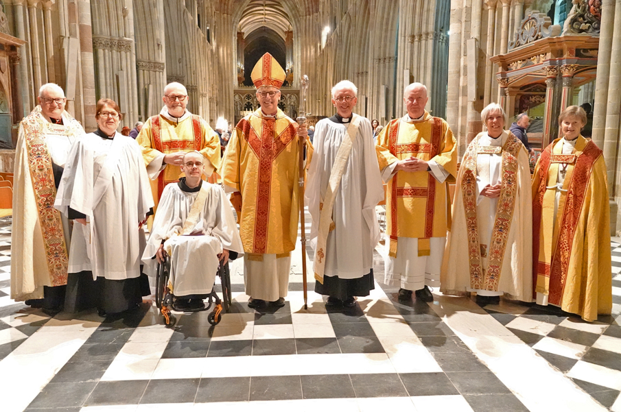 New Deacons alongside Bishop Martin and other clergy involved in the service at the back of the Cathedral
