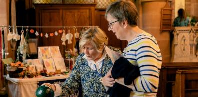 People looking at crafts in Hallow Church