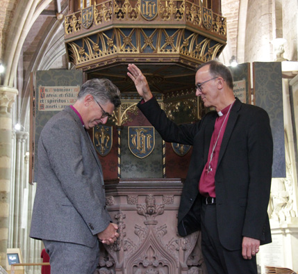 Bishop John blessing Bishop Martin