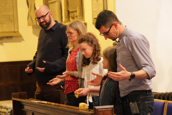 Andy Smith and his family praying