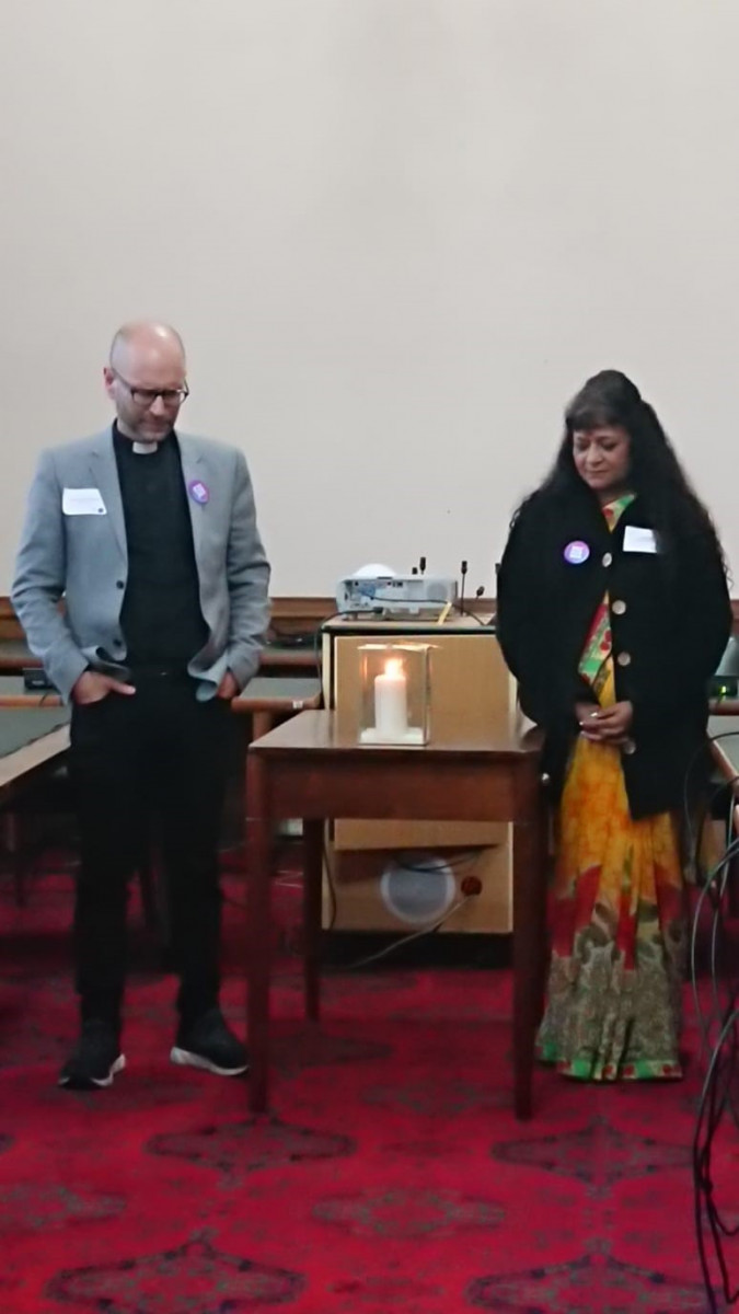 James Treasure & Mina Patel light a candle