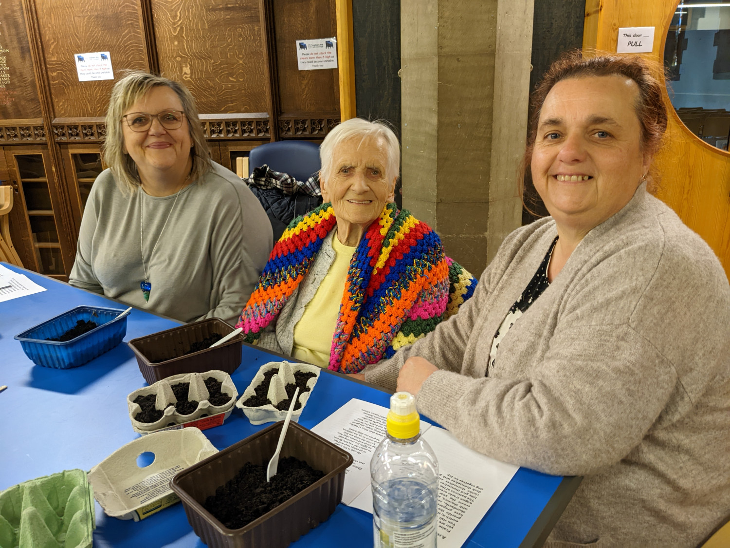 Three people at the informal service