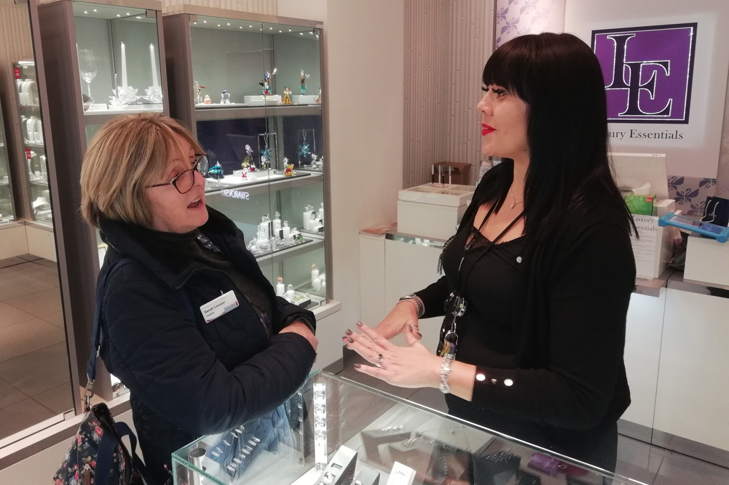 A Chaplain talking to a shop worker