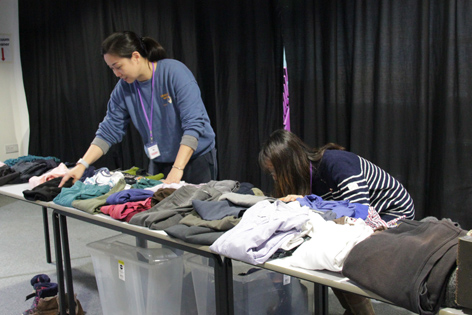 Volunteers sorting clothes