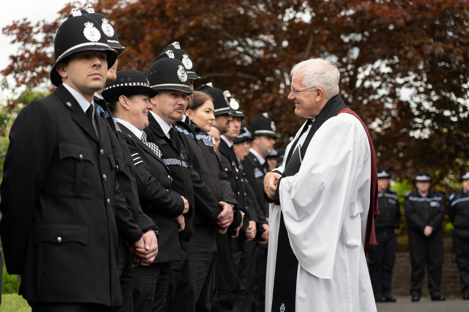 Dick Johnson talking to police outside church