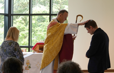 Bishop John blessing Phil Bradford with Kath Davis