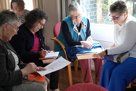 Small group of Readers studying a bible passage